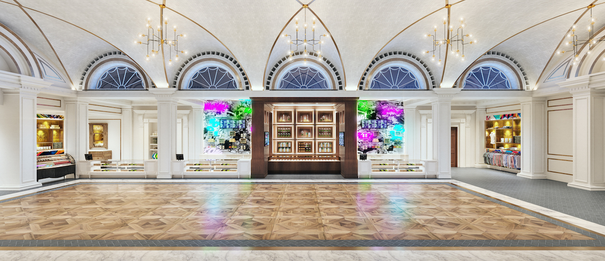 inside a spacious dispensary with multicolored wood floors and ornate white pillars and ceilings glass display cases line thee walls and chandeliers hang from the ceiling