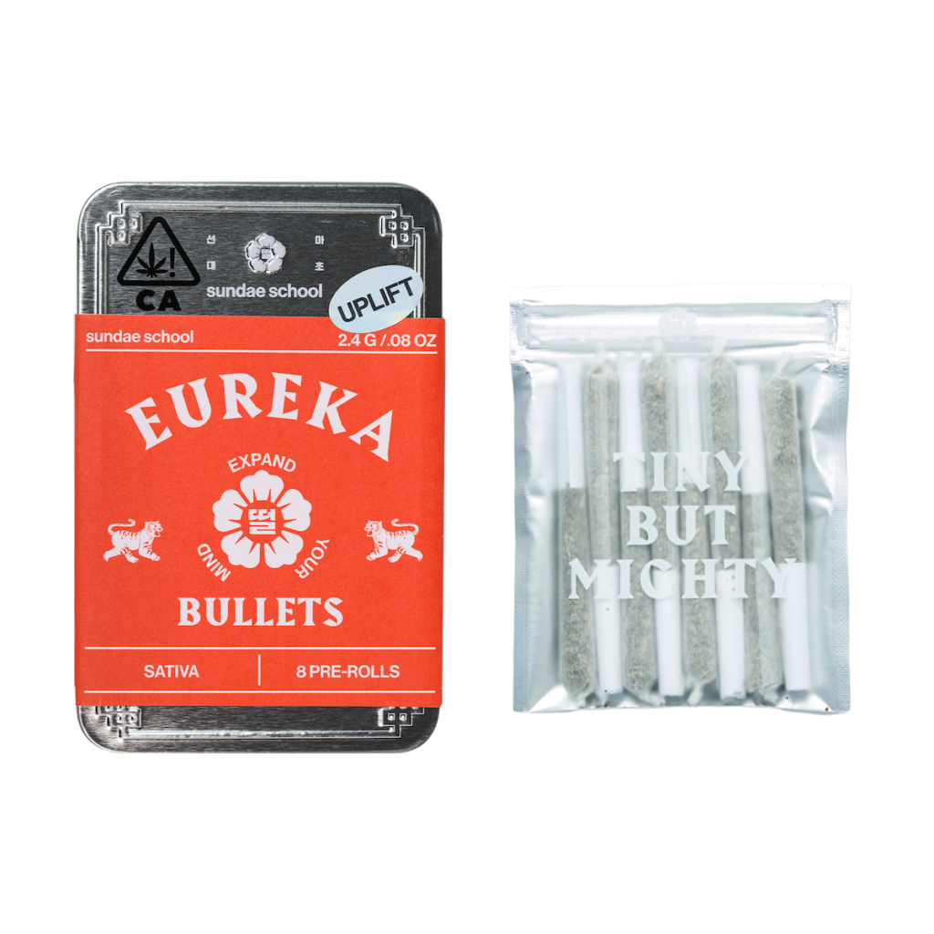 an image of a silver metal preroll container with a red label with Eureka bullets next to the joints that come inside the package in a clear plastic ziploc  