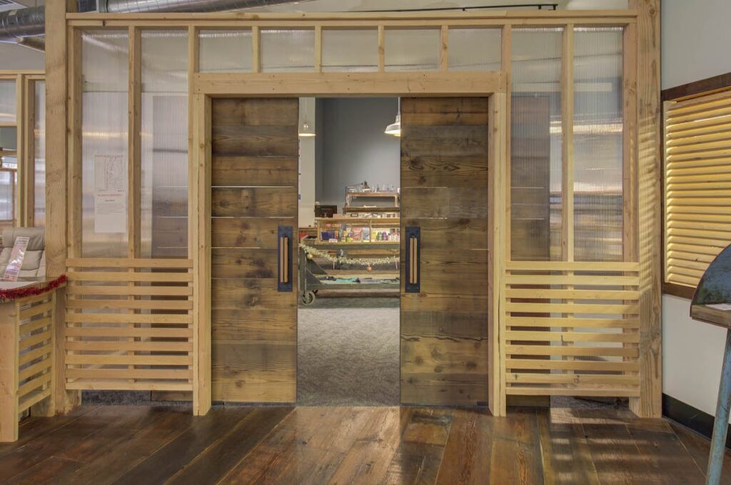 dispensary lobby with sliding wooden doors and a translucent divider wall