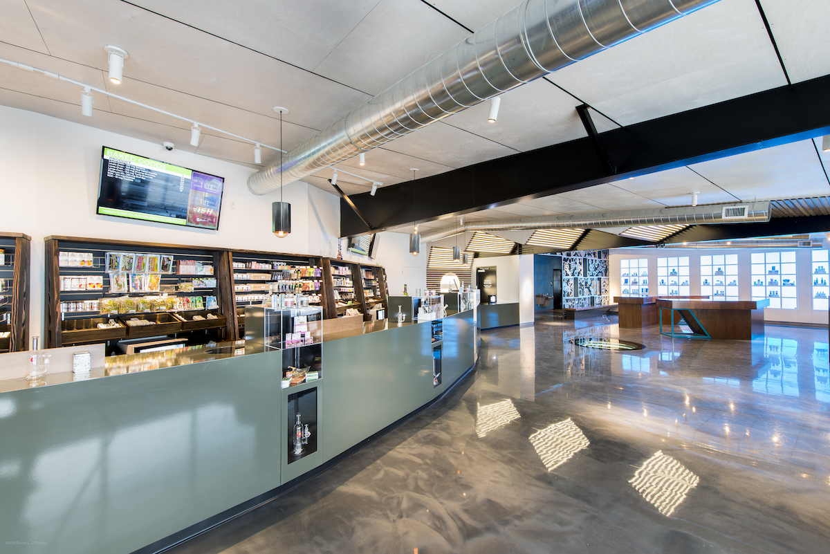 industrial chic neutral tones dispensary interior