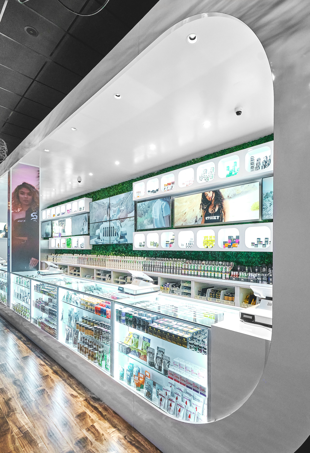 dispensary display cases embedded into a white wall