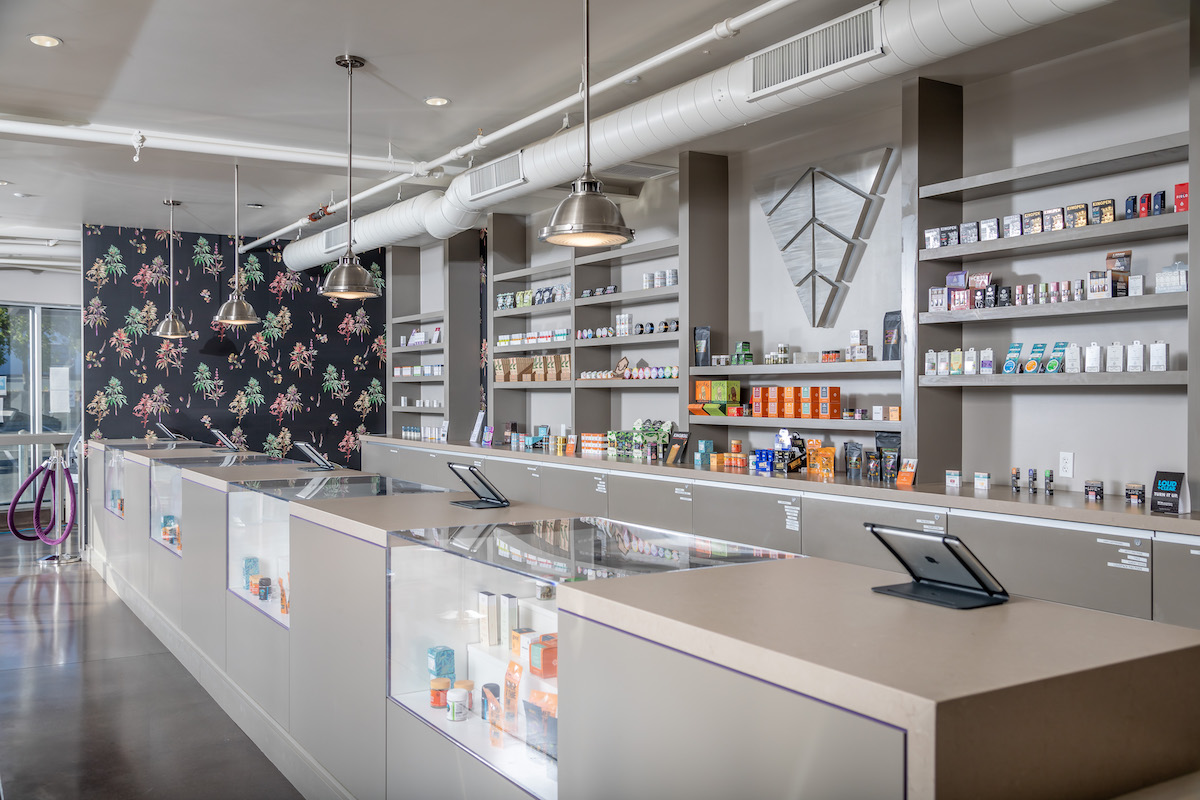 dispensary display cases embedded into a white wall