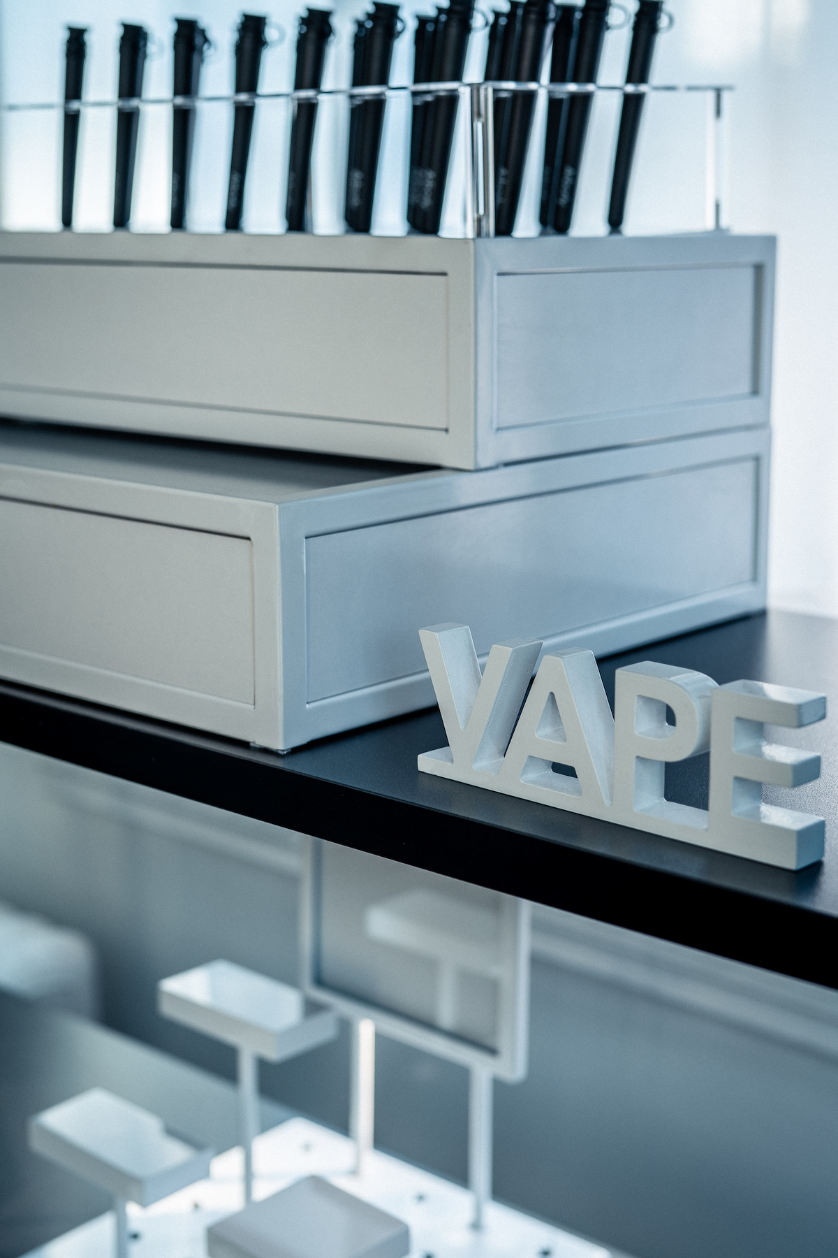 close up of product display with a sign that says vape